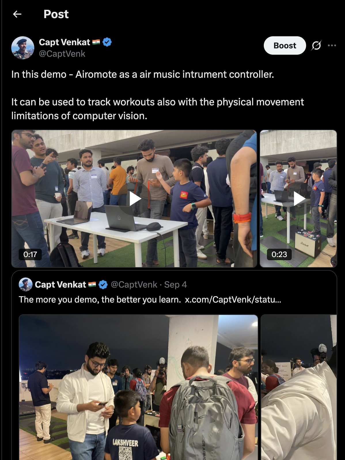 Lakshveer demoing the device to a crowd at a tech meetup, with an amplifier on stage